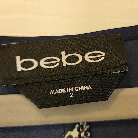 BEBE Denise Full Wrap Ruffle Detail Dress, Red & Pink Lipstick Print Novelty | 2 - Picture 3 of 12